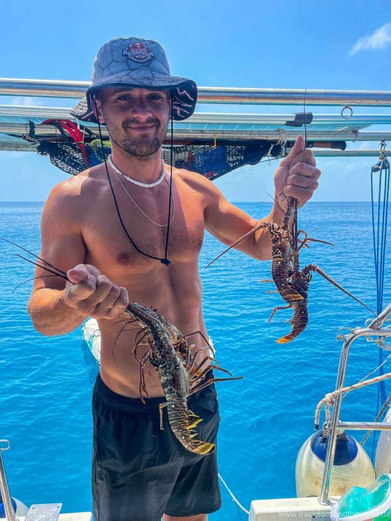 Nomad Sailors Captain Boris buys fresh fish food from the Guna Community